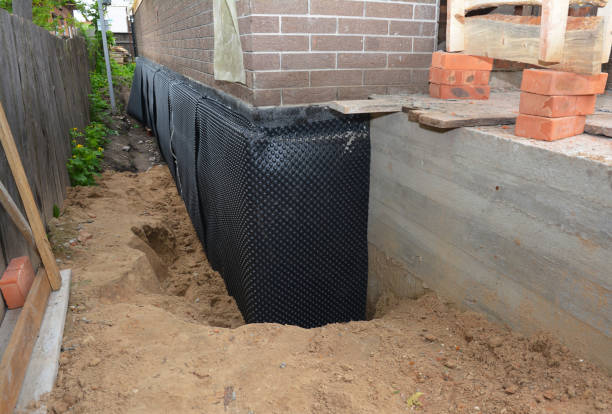 SJ Waterproofing Pros technician performing targeted Vapor Barrier Installation assessment in Northfield, IL